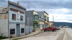  Dawson City storefronts, dirt roads, pickups