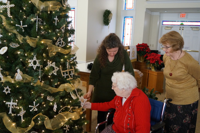  Mom explains some of the Christian symbols on the tree