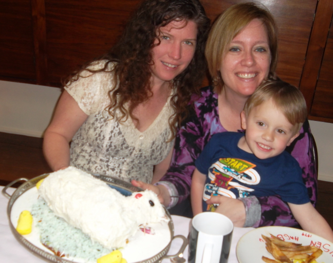 Alex, his mom, and his aunt show off the Easter lambie cake