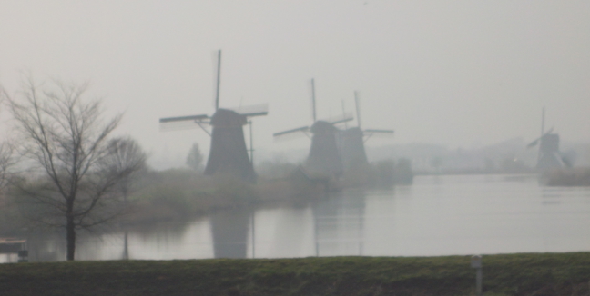 Windmills in the mist at Kinderdijk