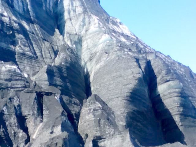 Closeup of the glacier -- bright blue under the dirt