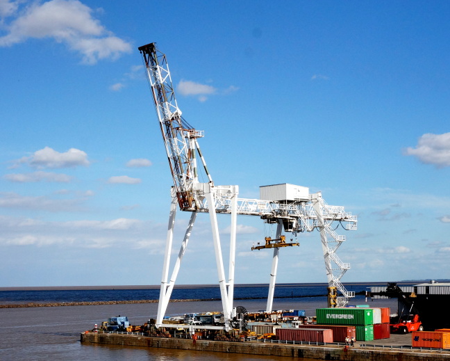 Crane waits to move containers between ship and shore, Buenos Aires