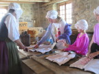  Children preparing "codfish" for drying, Fortress Louisburg