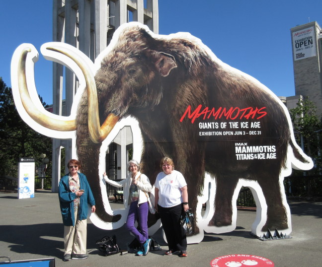 Visitors get shot in front of the mammoth ad, Victoria BC