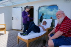  Derek and Fred relax on the balcony while Joann talks
