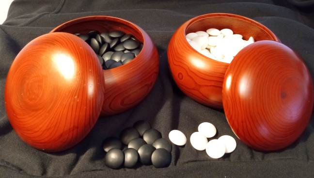 glass stones in wood bowls (? Chinese quince)