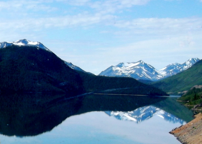 Reflections on crystal glacial lake south of Whitehorse, Yukon