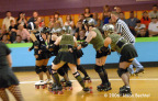  Bex Pistol makes room for her jammer to scoot through and score 