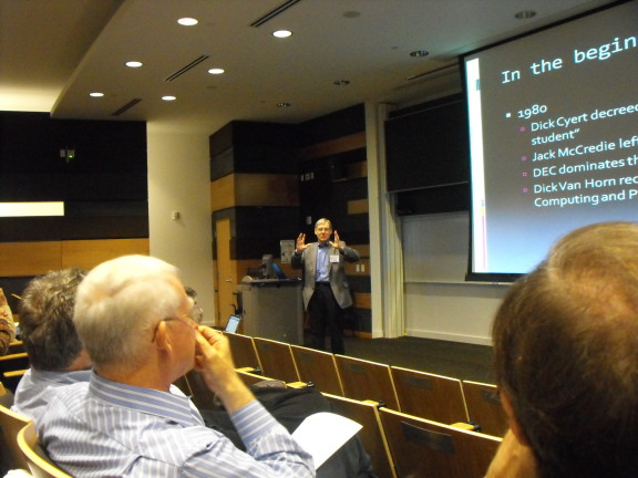 Doug van Houweling talks while John Howard listens