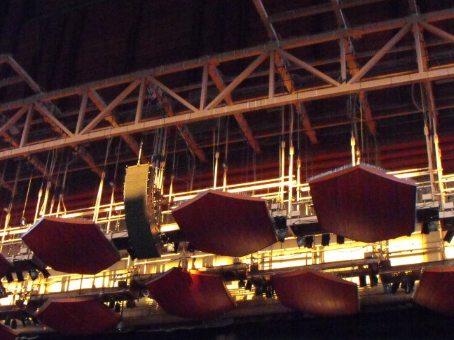 Sound baffles above the Wolftrap stage back lit by the setting sun
